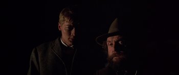 Movie still from “Young Winston” (1972), directed by Richard Attenborough – A man with a beard and a man with a hat; Close Up shot, Low angle