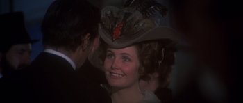 Movie still from “Young Winston” (1972), directed by Richard Attenborough – A person wearing a hat; Close Up shot, Over the shoulder angle