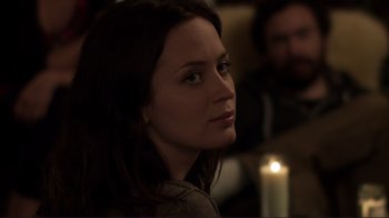 Movie still from “Your Sister's Sister” (2011), directed by Lynn Shelton – A woman sitting in front of a lit candle; Close Up shot, Over the shoulder angle