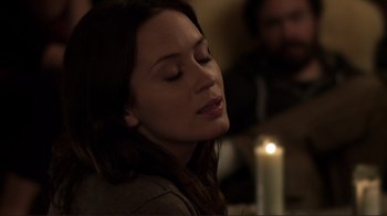 Movie still from “Your Sister's Sister” (2011), directed by Lynn Shelton – A beautiful woman sitting in front of a lit candle; Close Up shot, Over the shoulder angle