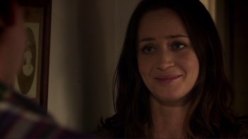 Movie still from “Your Sister's Sister” (2011), directed by Lynn Shelton – A woman smiling for the camera; Close Up shot, Over the shoulder angle