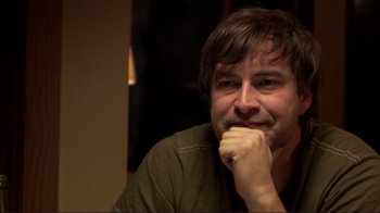 Movie still from “Your Sister's Sister” (2011), directed by Lynn Shelton – A person with his hand under his chin; Close Up shot, Over the shoulder angle