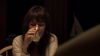 Movie still from “Your Sister's Sister” (2011), directed by Lynn Shelton – A woman is drinking a glass of wine; Close Up shot, Over the shoulder angle