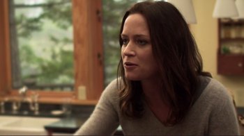 Movie still from “Your Sister's Sister” (2011), directed by Lynn Shelton – A person sitting at a table; Close Up shot, Over the shoulder angle