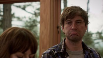Movie still from “Your Sister's Sister” (2011), directed by Lynn Shelton – A person sitting in front of a window; Close Up shot, Low angle