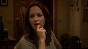 Movie still from “Your Sister's Sister” (2011), directed by Lynn Shelton – A woman sitting in front of a mirror with her hand under her chin; Close Up shot, Over the shoulder angle