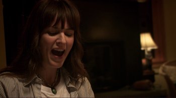 Movie still from “Your Sister's Sister” (2011), directed by Lynn Shelton – A woman with long brown hair is singing; Close Up shot, Low angle
