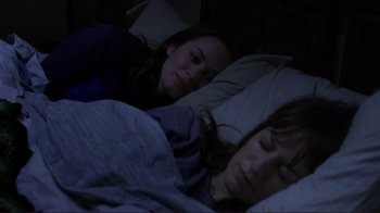 Movie still from “Your Sister's Sister” (2011), directed by Lynn Shelton – Two women are sleeping in a bed together; Medium shot, High angle