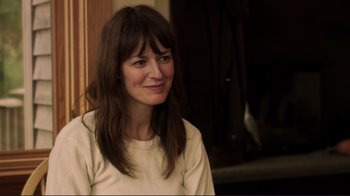 Movie still from “Your Sister's Sister” (2011), directed by Lynn Shelton – A woman with long brown hair wearing a white shirt; Close Up shot, Over the shoulder angle