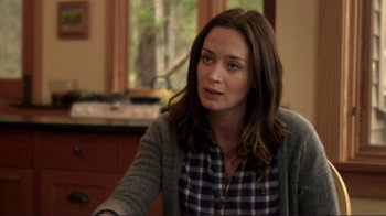 Movie still from “Your Sister's Sister” (2011), directed by Lynn Shelton – A person sitting at a table in a room; Close Up shot, Over the shoulder angle