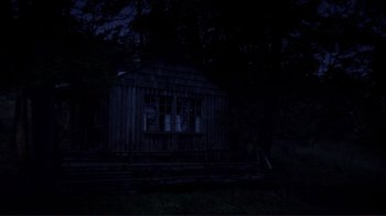Movie still from “Your Sister's Sister” (2011), directed by Lynn Shelton – A dark picture of an old house in the woods; Extreme Wide shot, Low angle