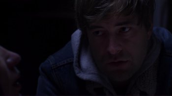Movie still from “Your Sister's Sister” (2011), directed by Lynn Shelton – A person wearing a hooded jacket; Close Up shot, Over the shoulder angle