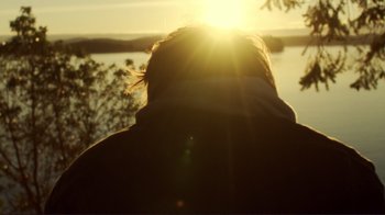 Movie still from “Your Sister's Sister” (2011), directed by Lynn Shelton – A person is looking out at the sunset; Close Up shot, Low angle