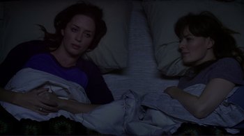 Movie still from “Your Sister's Sister” (2011), directed by Lynn Shelton – Two women are lying in a bed together; Medium shot, Overhead angle