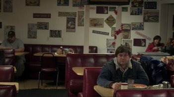 Movie still from “Your Sister's Sister” (2011), directed by Lynn Shelton – A man sitting at a booth in a restaurant; Medium shot, High angle