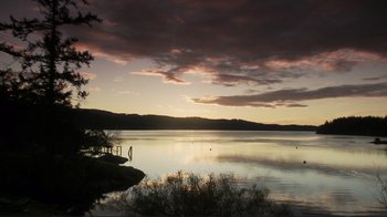 Movie still from “Your Sister's Sister” (2011), directed by Lynn Shelton – A body of water at sunset with a cloudy sky; Extreme Wide shot, Low angle