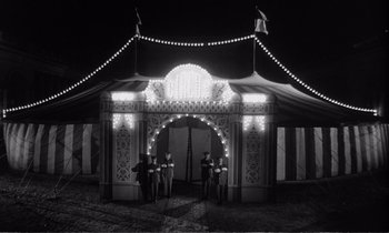 Movie still from “Yoyo” (1965), directed by Pierre Étaix – A black and white photo of a circus tent; Wide shot, Low angle