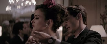 Movie still from “Yves Saint Laurent” (2014), directed by Jalil Lespert – A man and a woman are looking into each others eyes; Close Up shot, Over the shoulder angle