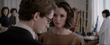 Movie still from “Yves Saint Laurent” (2014), directed by Jalil Lespert – A man and a woman looking at one another; Close Up shot, Over the shoulder angle
