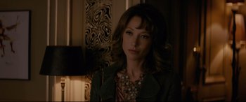 Movie still from “Yves Saint Laurent” (2014), directed by Jalil Lespert – A person wearing a jacket; Close Up shot, Over the shoulder angle