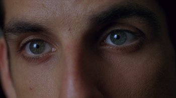 Movie still from “Zero Effect” (1998), directed by Jake Kasdan – View of a person's eyes; Extreme Close Up shot, Overhead angle