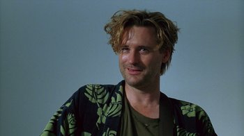 Movie still from “Zero Effect” (1998), directed by Jake Kasdan – A person wearing a robe; Close Up shot, Low angle