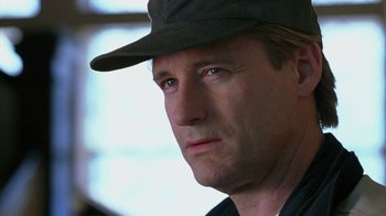 Movie still from “Zero Effect” (1998), directed by Jake Kasdan – A person wearing a hat; Close Up shot, Low angle