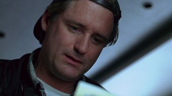 Movie still from “Zero Effect” (1998), directed by Jake Kasdan – A person wearing a headband; Close Up shot, Low angle