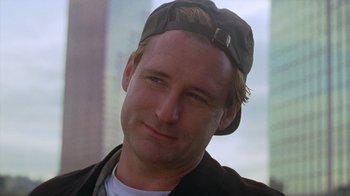 Movie still from “Zero Effect” (1998), directed by Jake Kasdan – A person wearing a hat; Close Up shot, Low angle