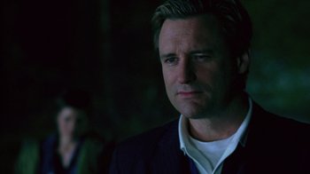 Movie still from “Zero Effect” (1998), directed by Jake Kasdan – A person wearing a suit and tie; Close Up shot, Low angle