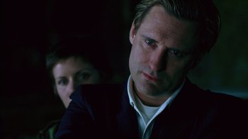 Movie still from “Zero Effect” (1998), directed by Jake Kasdan – A person wearing a suit and tie; Close Up shot, Over the shoulder angle