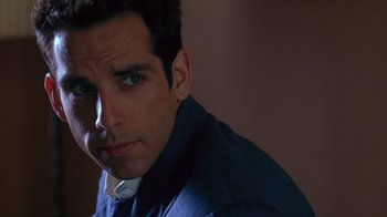 Movie still from “Zero Effect” (1998), directed by Jake Kasdan – A person wearing a suit and tie; Close Up shot, Over the shoulder angle