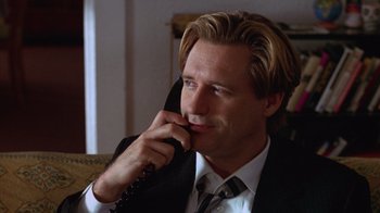 Movie still from “Zero Effect” (1998), directed by Jake Kasdan – A person talking on a phone; Close Up shot, Low angle