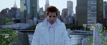 Movie still from “Zoolander” (2001), directed by Ben Stiller – Ben stiller in a white suit in front of a city skyline; Medium shot, Over the shoulder angle