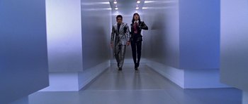 Movie still from “Zoolander” (2001), directed by Ben Stiller – A man and a woman walking down a hall way; Wide shot, Low angle
