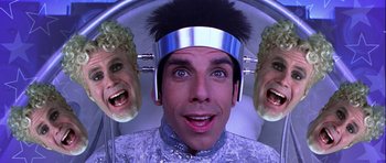 Movie still from “Zoolander” (2001), directed by Ben Stiller – A man in a space helmet with two heads in front of him; Close Up shot, Overhead angle