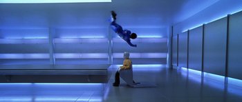Movie still from “Zoolander” (2001), directed by Ben Stiller – A man flying through the air while sitting on top of a chair; Wide shot, High angle