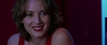 Movie still from “Zoolander” (2001), directed by Ben Stiller – A woman smiling for the camera; Close Up shot, Over the shoulder angle