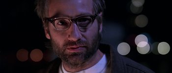 Movie still from “Zoolander” (2001), directed by Ben Stiller – A person wearing glasses and a beard; Close Up shot, Low angle
