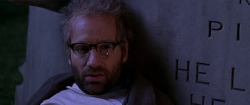 Movie still from “Zoolander” (2001), directed by Ben Stiller – A person wearing glasses and a jacket; Close Up shot, Low angle