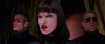 Movie still from “Zoolander” (2001), directed by Ben Stiller – A person wearing a wig and lipstick; Close Up shot, Low angle