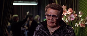 Movie still from “Zoolander” (2001), directed by Ben Stiller – An older man wearing glasses and a jacket; Close Up shot, Low angle