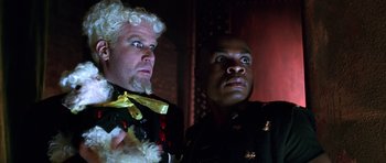 Movie still from “Zoolander” (2001), directed by Ben Stiller – Two men dressed up in costumes looking at each other; Close Up shot, Low angle