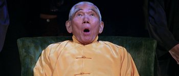 Movie still from “Zoolander” (2001), directed by Ben Stiller – An older man wearing a yellow shirt and looking surprised; Close Up shot, Low angle