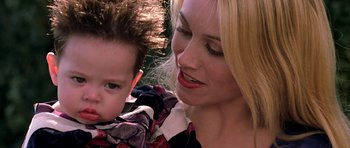 Movie still from “Zoolander” (2001), directed by Ben Stiller – A woman holding a child in her arms; Close Up shot, Over the shoulder angle