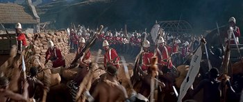 Movie still from “Zulu” (1964), directed by Cy Endfield – A group of men in red and white uniforms on horseback; Extreme Wide shot, High angle