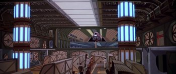 Movie still from “Star Trek: The Motion Picture” (1979), directed by Robert Wise – People are standing in a train station with a train on the wall; Extreme Wide shot, Low angle