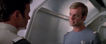 Movie still from “Star Trek: The Motion Picture” (1979), directed by Robert Wise – A man with blonde hair and a blue shirt; Close Up shot, Over the shoulder angle