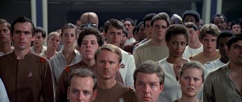 Movie still from “Star Trek: The Motion Picture” (1979), directed by Robert Wise – A large group of men standing in front of each other; Close Up shot, High angle