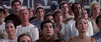 Movie still from “Star Trek: The Motion Picture” (1979), directed by Robert Wise – A group of people are gathered together in a room; Medium shot, Over the shoulder angle